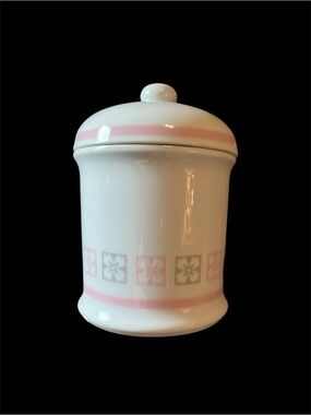 This is a vintage 1987 Avon white porcelain apothecary jar